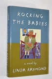 ROCKING THE BABIES by Linda Raymond (1994) REVIEW COPY / 1st Edition / Hardcover